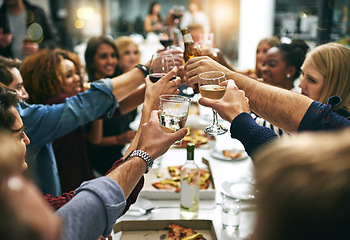 Image showing Dinner, toast and friends at restaurant for party celebration, social gathering and new years eve holiday. Alcohol, Christmas party and group of men and women cheers at dinner party with cocktails