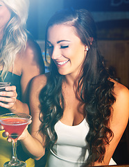 Image showing Party, cocktail and nightclub with a young woman and friends drinking in celebration of the new year. Birthday, event and social with an attractive young female enjoying a drink while clubbing