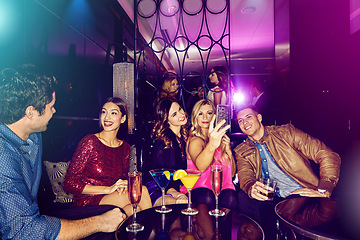 Image showing Friends group, nightclub selfie and phone for celebration, party and sitting on couch in night. Club cocktail, conversation and happy smartphone picture for social media, memory or new year in disco