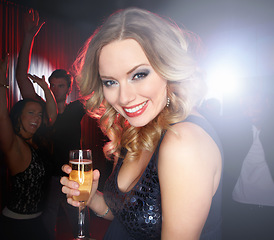 Image showing Party, champagne and portrait of woman in nightclub for celebration, new years and social event. Music, alcohol and face of happy girl enjoy festival, dance and happy hour at rave, disco and club