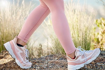 Image showing Fitness, running and shoes of woman on trail for jogging, trekking or adventure in nature. Workout, exercise and hiking with girl runner training on countryside path for jogging, endurance and cardio