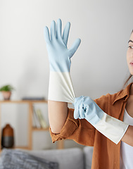 Image showing Woman, hand gloves and prepare to start cleaning, hygiene and housework in clean service, work and job in house. Female domestic worker, bacteria and cleaning service, zoom and cleaner in home