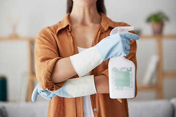 Image showing Woman, spring cleaning and spray bottle with arms crossed for housekeeping, sanitation or disinfection of dirt, bacteria and dust in home. Closeup maid, chemical cleaner product and house maintenance