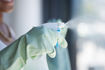 Image showing Hands, spray and detergent for cleaning window, domestic or housework chores at home. Hand with rubber glove spraying for clean hygiene, sanitary or anti bacteria chemical cleaner for washing glass