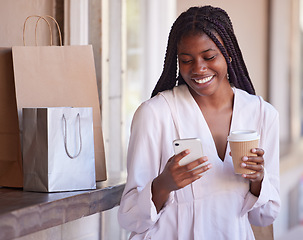 Image showing Black woman with smartphone on coffee break after shopping, retail and excited about sale, communication and technology with shopping bags. Discount, bargain and after shop coffee with phone and app.