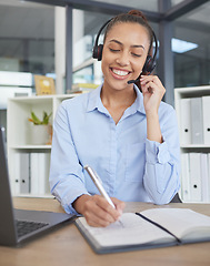 Image showing Call center, woman and writing notes for customer service, telemarketing sales or consulting at office desk in agency. Happy receptionist, communication and planning in notebook, solution and telecom