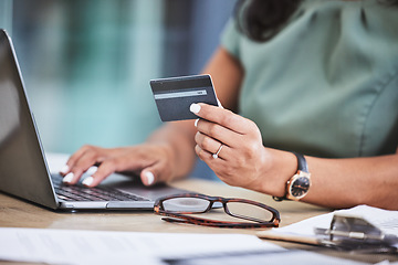 Image showing Online shopping, credit card and woman hands with laptop for ecommerce, payment and purchase on internet store. Technology, fintech and girl typing banking details on computer for online banking