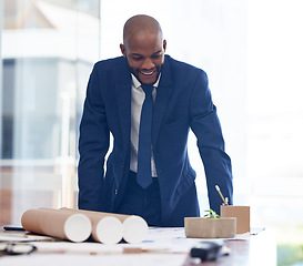 Image showing Businessman, happy and architect blueprint in office for building construction, engineering or architecture project illustration. African man, smile and working on industrial design or business plan