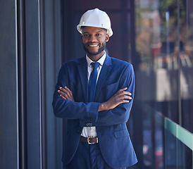 Image showing Black man, arms crossed or office building ideas, architecture innovation or property construction vision on balcony. Portrait, happy smile or real estate developer with hard hat or engineering goals