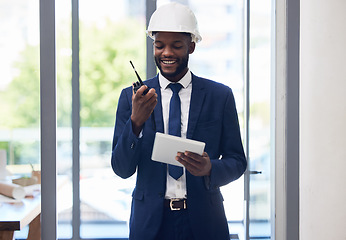 Image showing Black man, tablet and walkie talkie in construction management, office building schedule or architecture planning. Smile, happy and engineering worker with digital technology or communication device