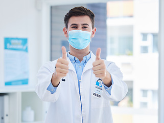 Image showing Covid, doctor thumbs up and face mask for medical corona virus healthcare, compliance safety and protection. Covid 19 health care, vaccine medicine and hospital or clinic professional with thank you