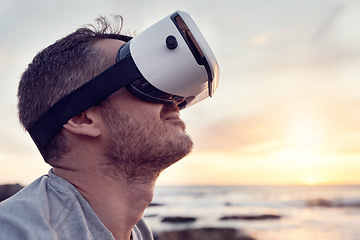 Image showing VR, beach and metaverse with a man in a nature using a wireless headset to access the internet. Future, virtual reality and ai with a male 3d user by the sea or ocean with cyber technology at sunset