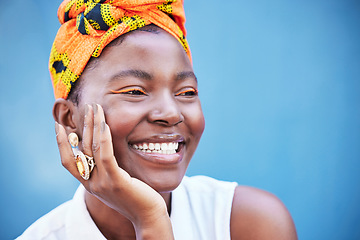 Image showing Makeup, black woman and smile with head wrap, eye lash color or confident on blue studio background. Jamaican female, girl and lady with traditional headscarf, stylish or cosmetics for natural beauty