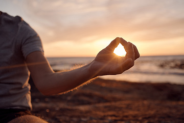 Image showing Beach meditation, sunset and hands of man meditate for peace, freedom and chakra energy healing of soul aura. Sun flare, lotus and spiritual yogi relax at ocean sea for zen mindset and mindfulness