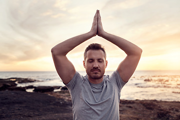 Image showing Zen man, beach meditation and sunset for peace, wellness or healthy mindset by waves in summer. Yoga, prayer hands pose or mindfulness by ocean, sunshine or relax for chakra energy balance in Hawaii