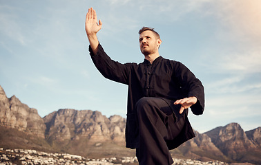 Image showing Tai chi, martial arts and fitness outdoor, man does karate and sport motivation, body training and wellness. Exercise at beach with mindfulness and energy, nature and self defense sports with focus.