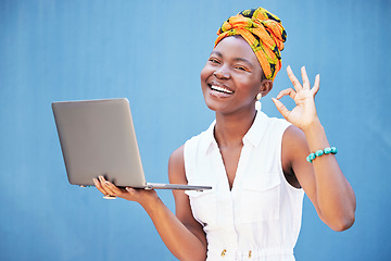 Image showing Perfect hand, laptop and black woman with success, digital marketing review and support for web trading on blue background in studio. Happy, ok emoji sign and portrait of worker with pc for marketing