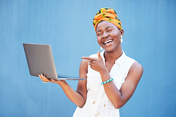 Image showing Laptop success, email and happy black woman with communication, online work and pointing at internet on blue background in studio. Computer, digital business and worker impressed with web networking