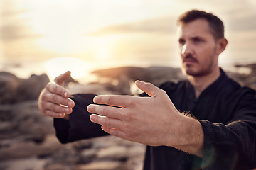 Image showing Man, hands and tai chi on sunset beach in relax workout, fitness or exercise for chakra balance, mental health or mind training. Zoom, sunrise martial arts and zen person by ocean water or nature sea