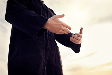 Image showing Praying, worship and Muslim man in nature for gratitude, peace and trust in God against a sky. Hope, Islam and person with hands for a prayer, Islamic praise and faith during Ramadan and sunset