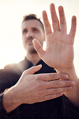 Image showing Man, hands and tai chi pose outdoor while training for health, wellness or fitness. Karate sports, martial arts or male athlete practicing fighting technique outside for workout, practice or exercise