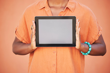 Image showing Marketing, advertising and woman with mockup tablet in hands, cropped on studio background with space for product placement. Digital Marketing, blank screen and orange campaign for web advertisement.