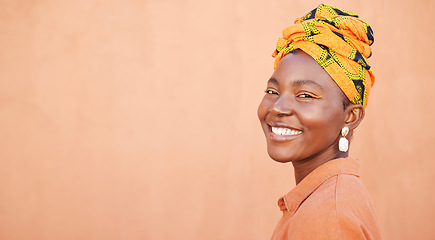 Image showing African, culture and portrait of happy black woman with pride in unique tradition, origin and South Africa heritage. Fashion mock up, head wrap and face of beauty girl isolated on mockup orange wall