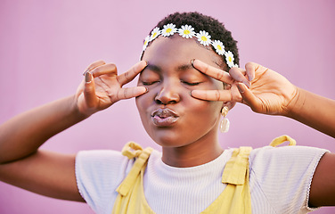 Image showing Black woman, peace fingers and eyes in studio for happiness, zen and relax with flower crown. African hipster girl, hands and finger sign on face with natural beauty, self care and pouting lips