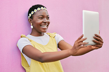 Image showing Tablet selfie, smile and happy black woman with picture memory of flower crown, beauty and vacation in South Africa. Spring fashion, online social media post and girl with digital tech on pink wall