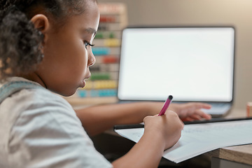 Image showing Home, elearning and little girl writing on paper with mockup screen on laptop for education. Focus, remote student and black child busy with homework at study desk in house with concentration.