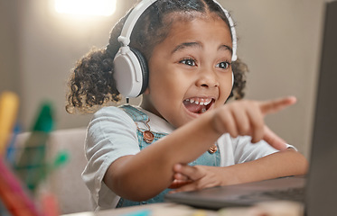 Image showing Student, education and remote learning with an excited black girl in her home using a laptop and headphones. Computer, study and elearning with a female child in her house for studying or development