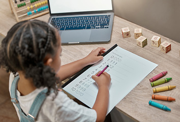 Image showing Child, laptop and math homework while writing in a notebook for online learning at home. Elearning, digital education and mathematics lesson with distance education for little girl using the internet