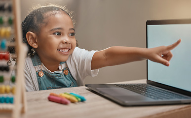 Image showing Education, home school and elearning with a student girl pointing at a laptop while studying for development. Computer, math and internet with a female child pupil remote learning alone in her house