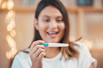 Image showing Pregnancy test, excited and face of a woman reading results, wow smile and hand with surprise in a house. Happy, pregnant and mother with a test for pregnancy, good news and happiness in a home