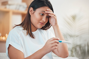 Image showing Wow, pregnant woman and pregnancy test in hands for pregnant unplanned surprise on sofa of living room at home. Indian woman learning good news, shock and happy face for fertility for future family