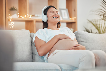 Image showing Pregnant woman, relax and headphones for listening to music on sofa for healthy zen, calm and peace for wellness or soothing at home. Happy female with pregnancy tummy on living room couch to rest