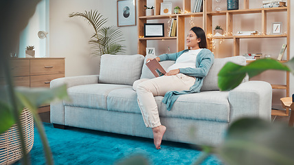 Image showing Pregnant woman, relax and reading book on sofa in home, thinking or contemplating. Pregnancy, idea and female sitting on couch studying literature, fantasy story or novel in lounge of house alone.
