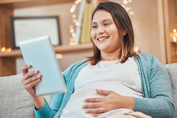 Image showing Relax, pregnancy and woman on sofa with tablet in living room at home reading email or ebook. Internet, video call or social media, happy pregnant woman sitting on couch with smile surfing online.