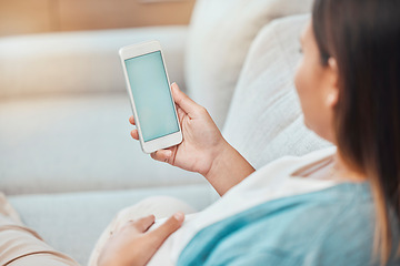 Image showing Pregnant woman, phone green screen and mock up on sofa for marketing, advertising or promotion. Pregnancy, chroma key and female with mobile smartphone for texting, social media or internet browsing.