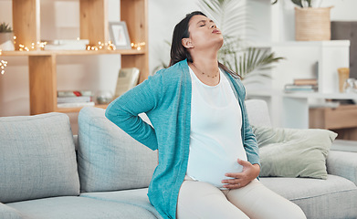 Image showing Pregnant woman, breathing and stomach pain on sofa in living room for childbirth wellness, pregnancy healthcare or mother with backpain. New mom, stress and painful prenatal care or breath on couch