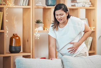 Image showing Pregnant woman, pain and cramps with hand on stomach for abdominal problem, discomfort or childbirth contractions for labour. Female with stress, stomachache or spasm causing miscarriage in pregnancy