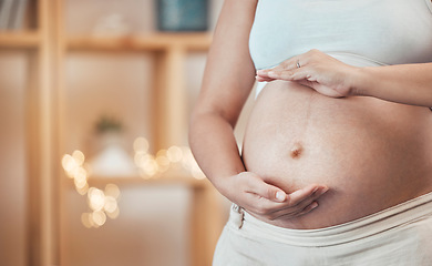 Image showing Pregnant, stomach and woman frame her belly in maternity ready for motherhood to be a parent. Motherhood, abdomen and pregnancy with a female ready to have a family and babies at home