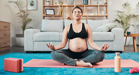 Image showing Pregnant woman, yoga and medication on home floor for balance, mental health and mindfulness for health and wellness with lotus exercise workout. Female meditate for zen, peace and calm in pregnancy