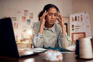 Image showing Designer, headache and woman stress in studio for creative burnout, management anxiety or fashion mistake. Black woman, frustrated and overworked fashion designer or tailor working on clothes design