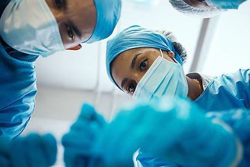 Image showing Diversity, teamwork or surgery doctors in medical emergency operation, healthcare or collaboration with patient. Face mask, doctor or nurse team for cancer treatment, heart or help in hospital