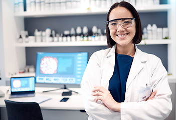 Image showing Portrait, laboratory and Asian woman crossed arms, research and scientific methods for healthcare or cure. Computer, female researcher or medical professional for innovation, lab equipment and expert
