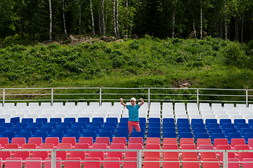 Image showing Lonely boy on the empty stadium outdoor