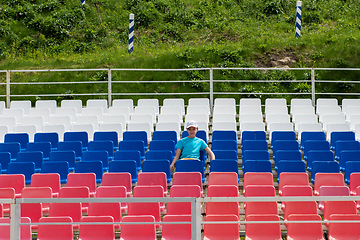 Image showing Lonely boy on the empty stadium outdoor