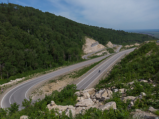 Image showing Aerial top vew of winding road in the mountains