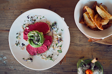 Image showing Food, health and breakfast with avocado toast from top view for diet, nutrition and vegan in coffee shop. Bread, sandwich and brunch with beetroot hummus for luxury, cafe an restaurant fine dining